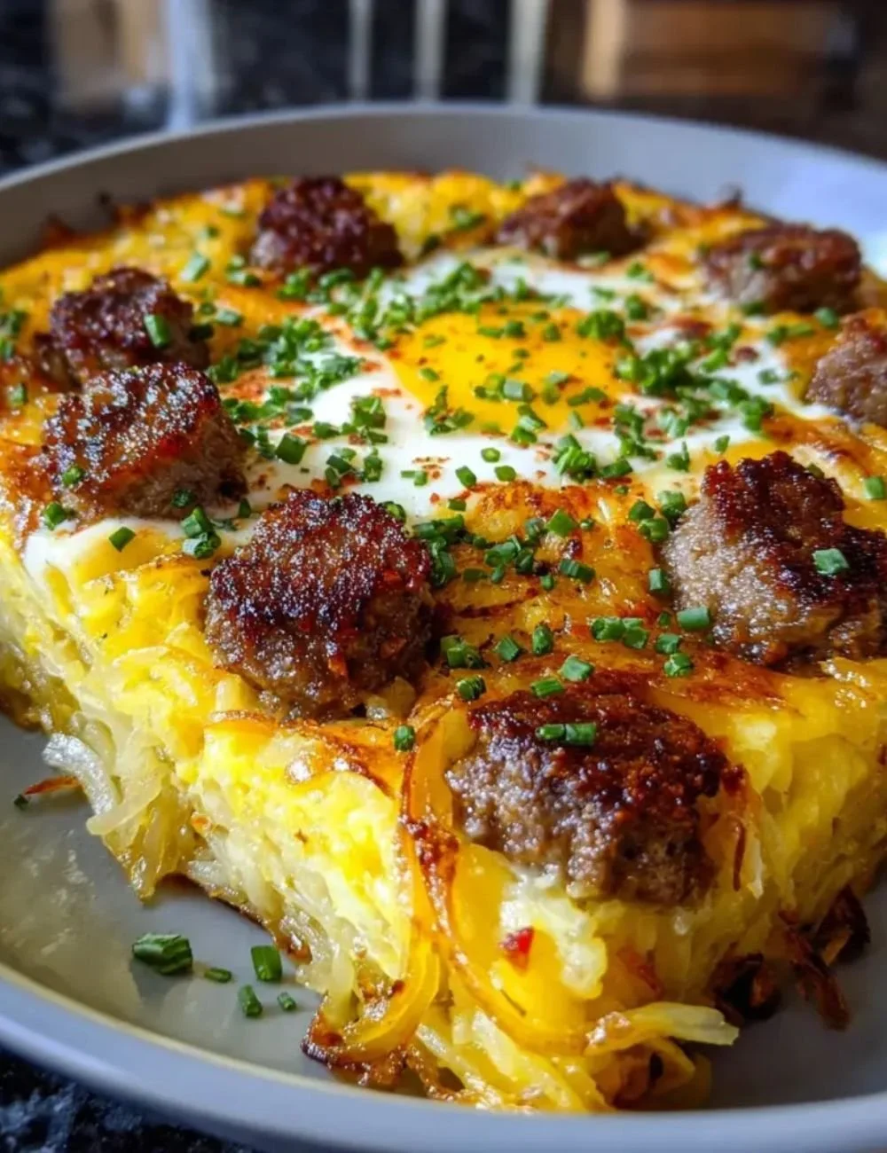 Delicious Sausage Hashbrown breakfast dish served on a plate.