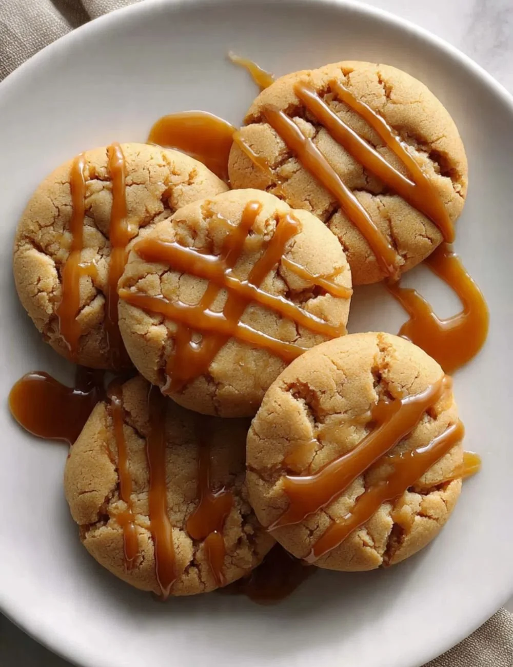 Freshly baked spicy caramel cookies on a tray