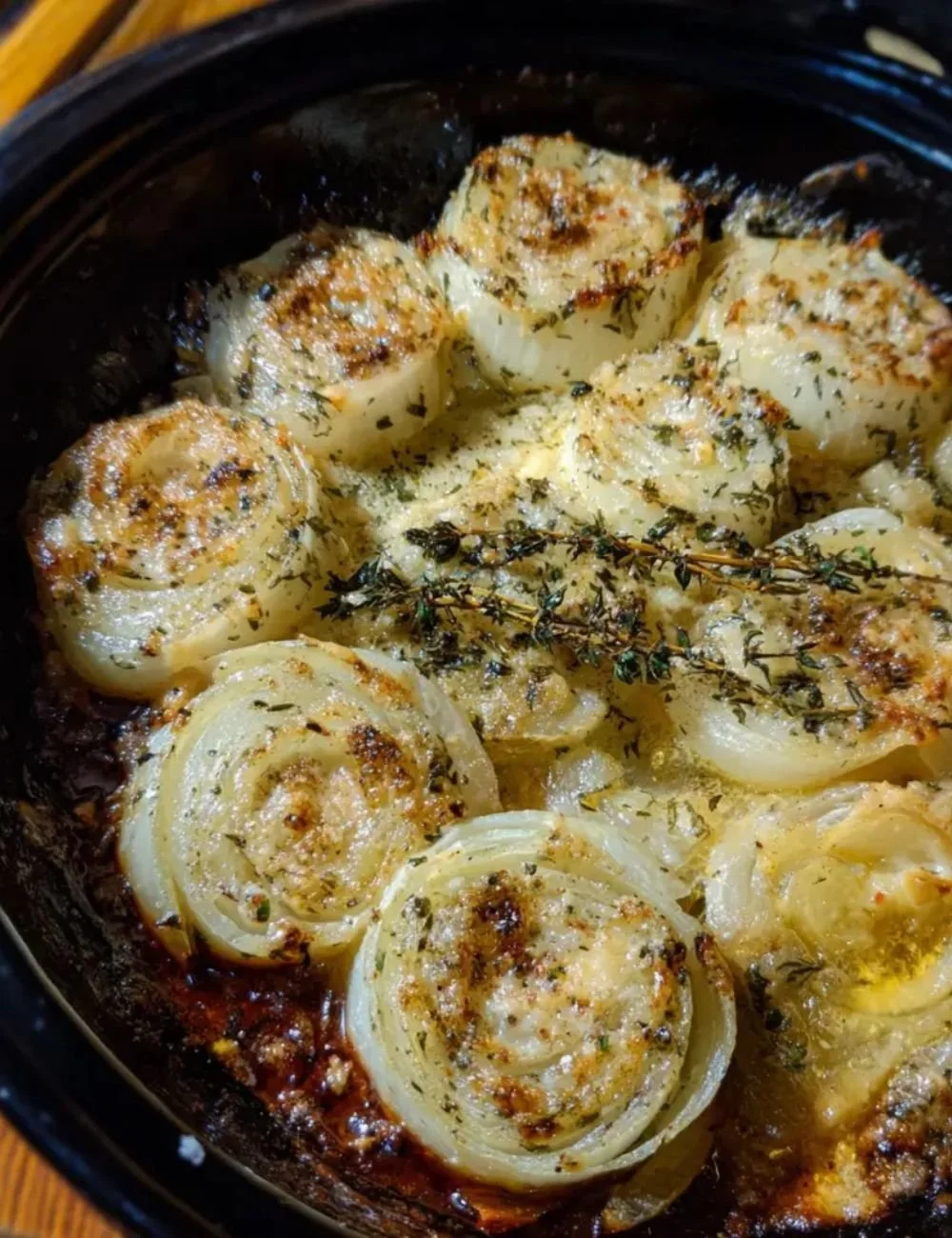 Plate of Asiago Roasted Onions garnished for a delicious side dish.