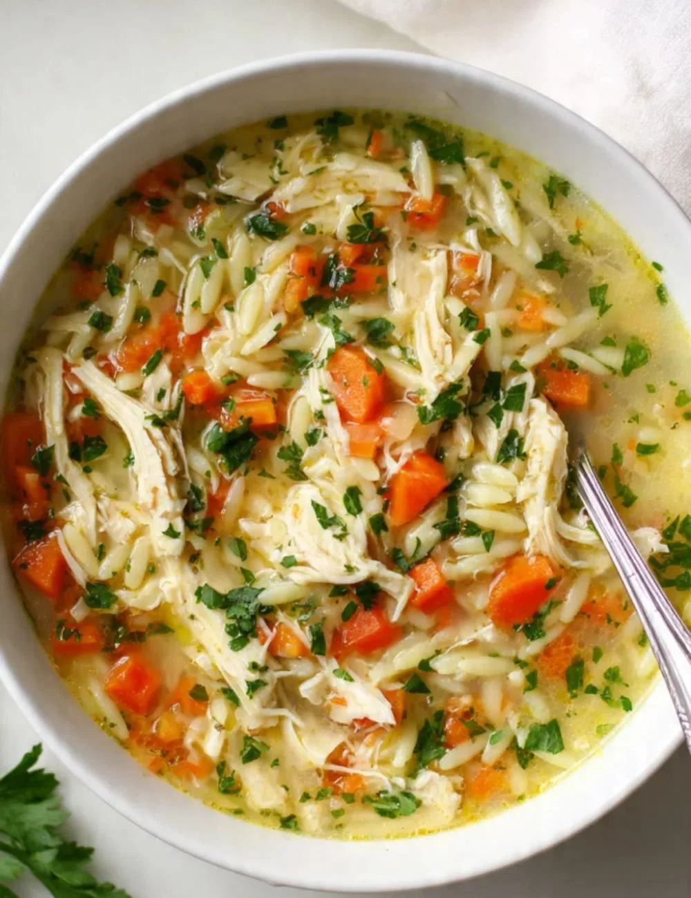Bowl of delicious Chicken Orzo Soup with tender chicken and orzo pasta