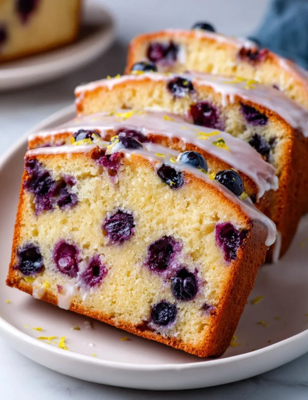 Costco lemon blueberry pound cake with fresh blueberries and lemon zest