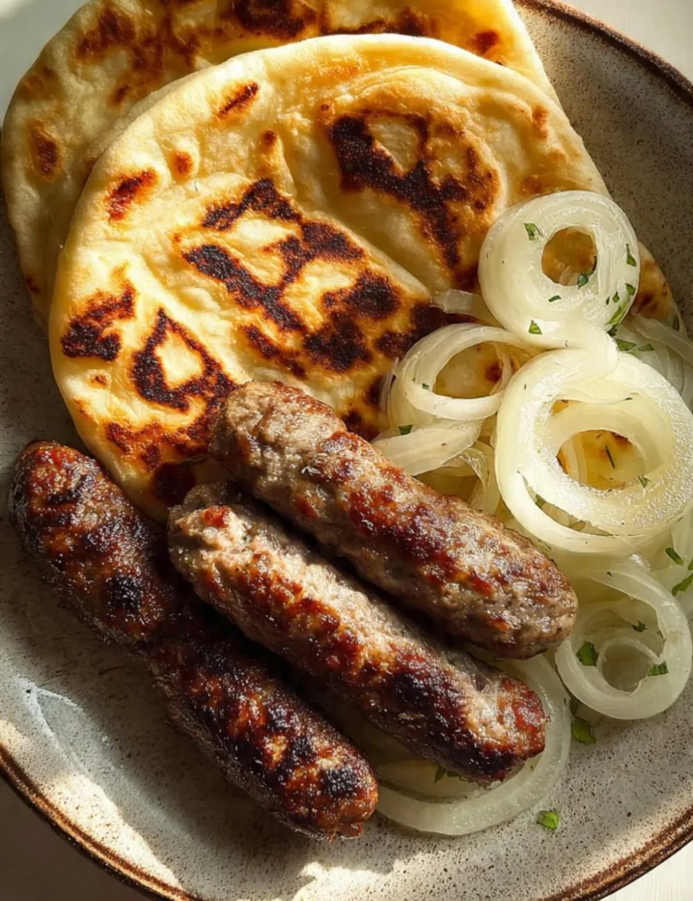Delicious homemade Cevapi sausages on a grill ready to serve.