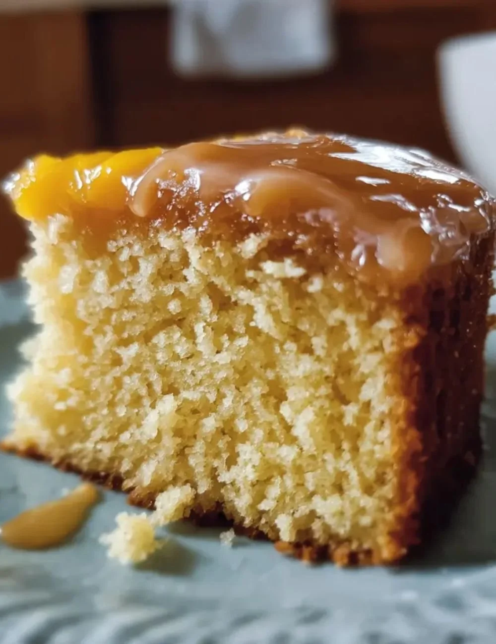 Brown Sugar Peach Cake topped with fresh peach slices and brown sugar glaze
