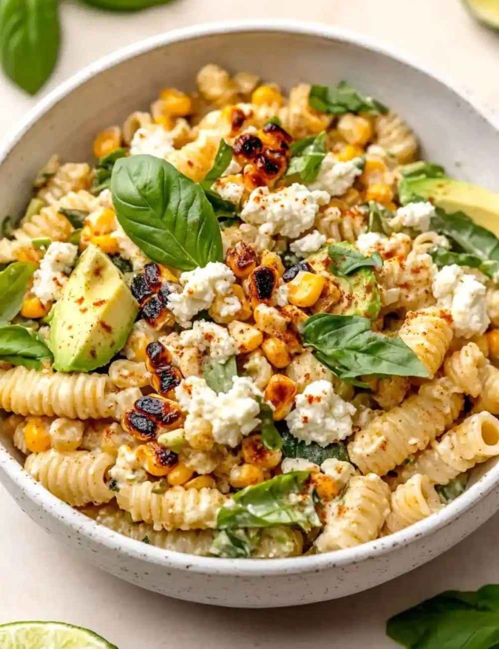 Creamy street corn pasta salad with fresh ingredients in a bowl