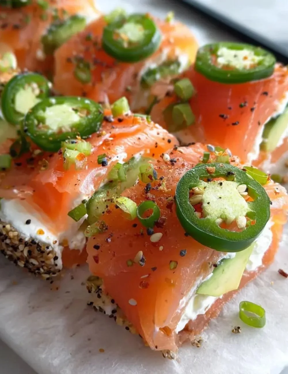 Easter smoked salmon and cream cheese roll ups on a serving platter.