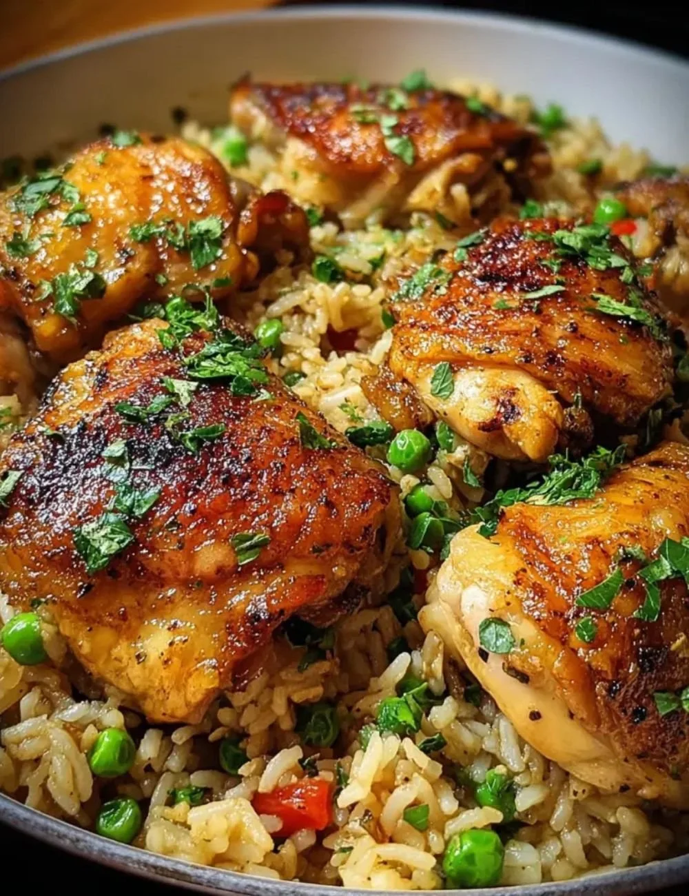 One-Pot Chicken and Rice dish served in a bowl with herbs