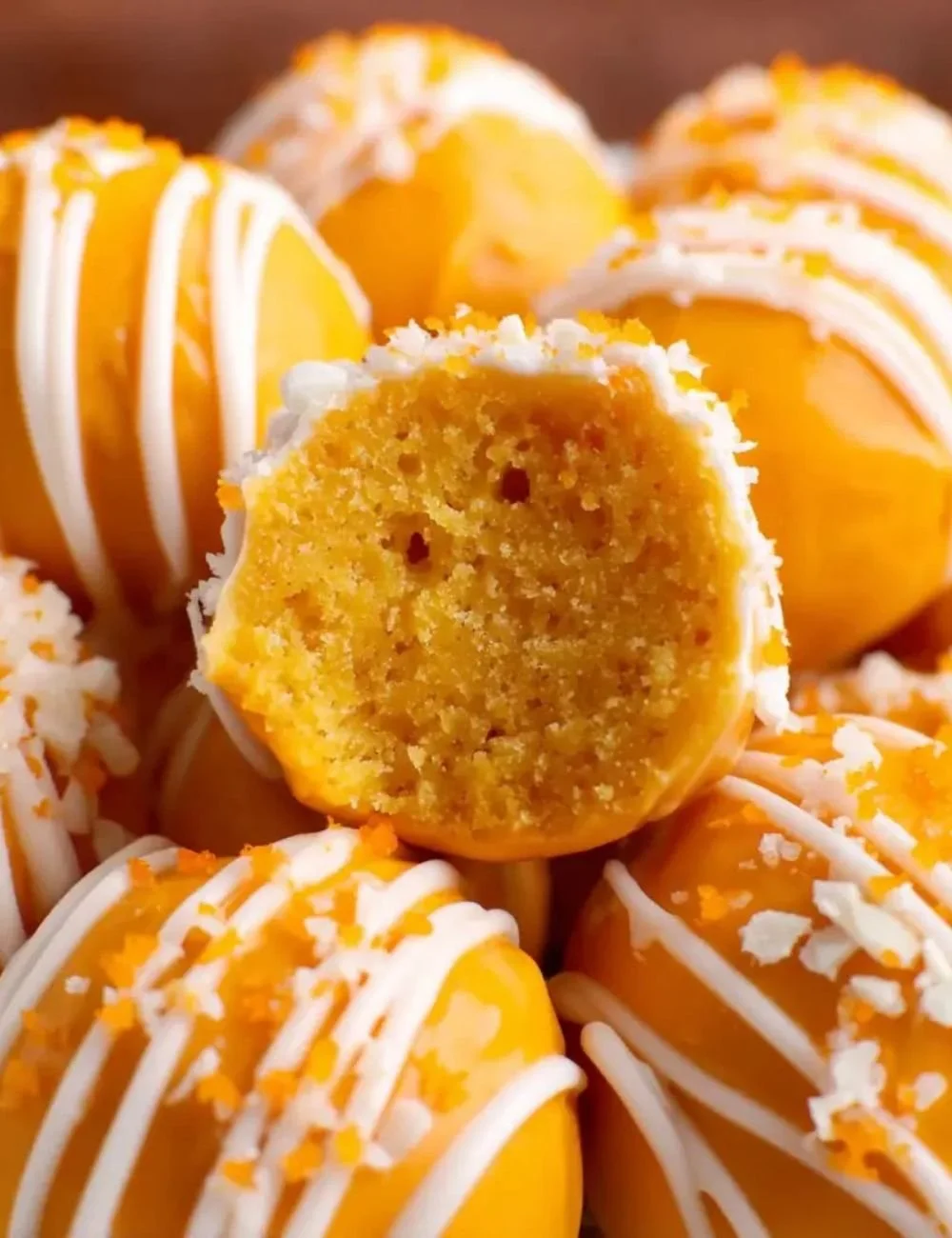 Delicious homemade orange truffles decorated with orange zest and chocolate