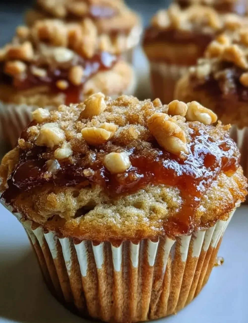 Freshly baked Peanut Butter Guava Muffins on a wooden table