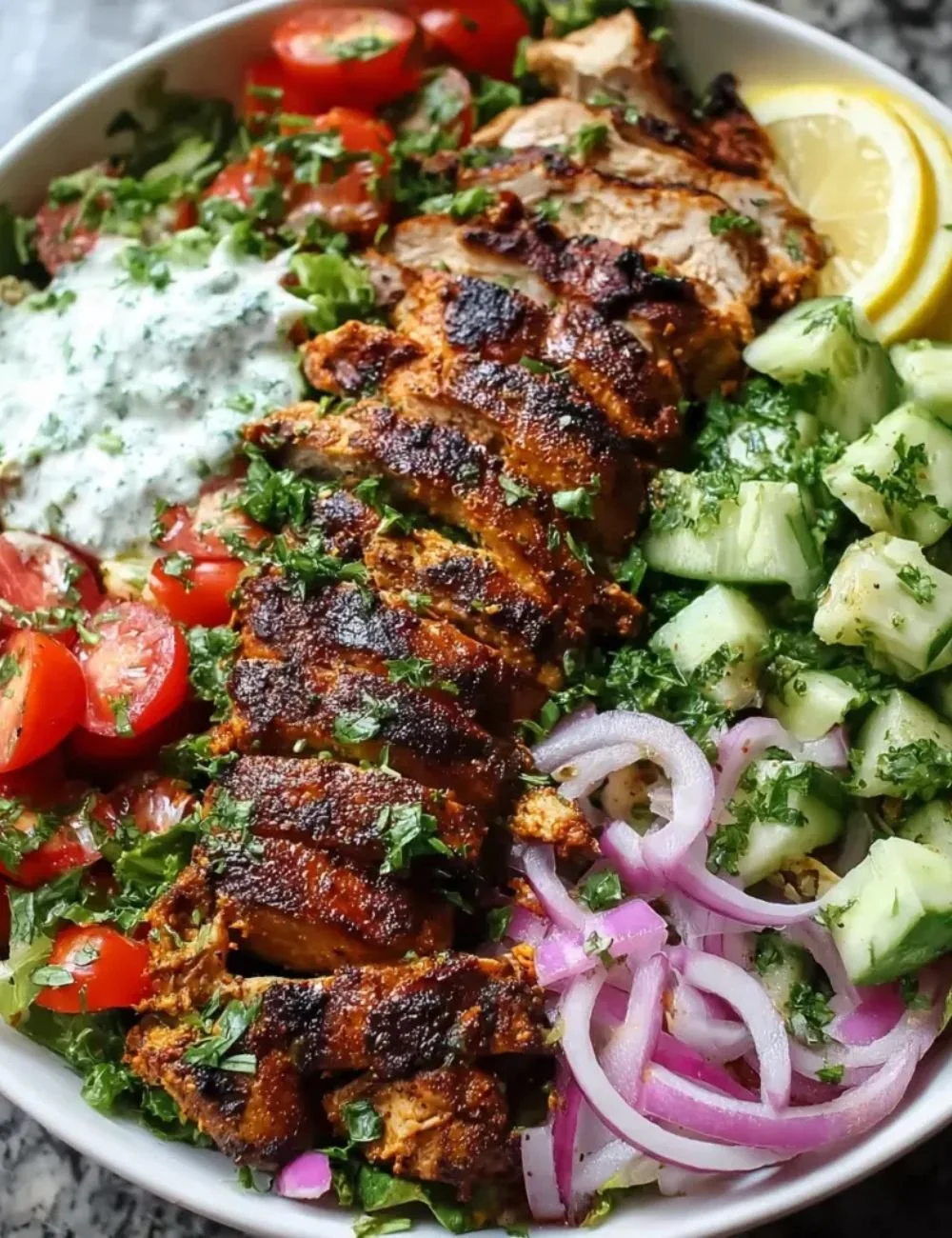 Spiced grilled chicken salad with fresh greens and vibrant vegetables