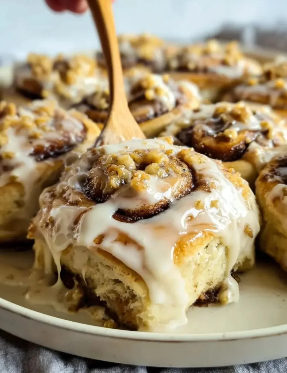 Delicious homemade Banana Nut Cinnamon Rolls with nuts and cinnamon on a plate
