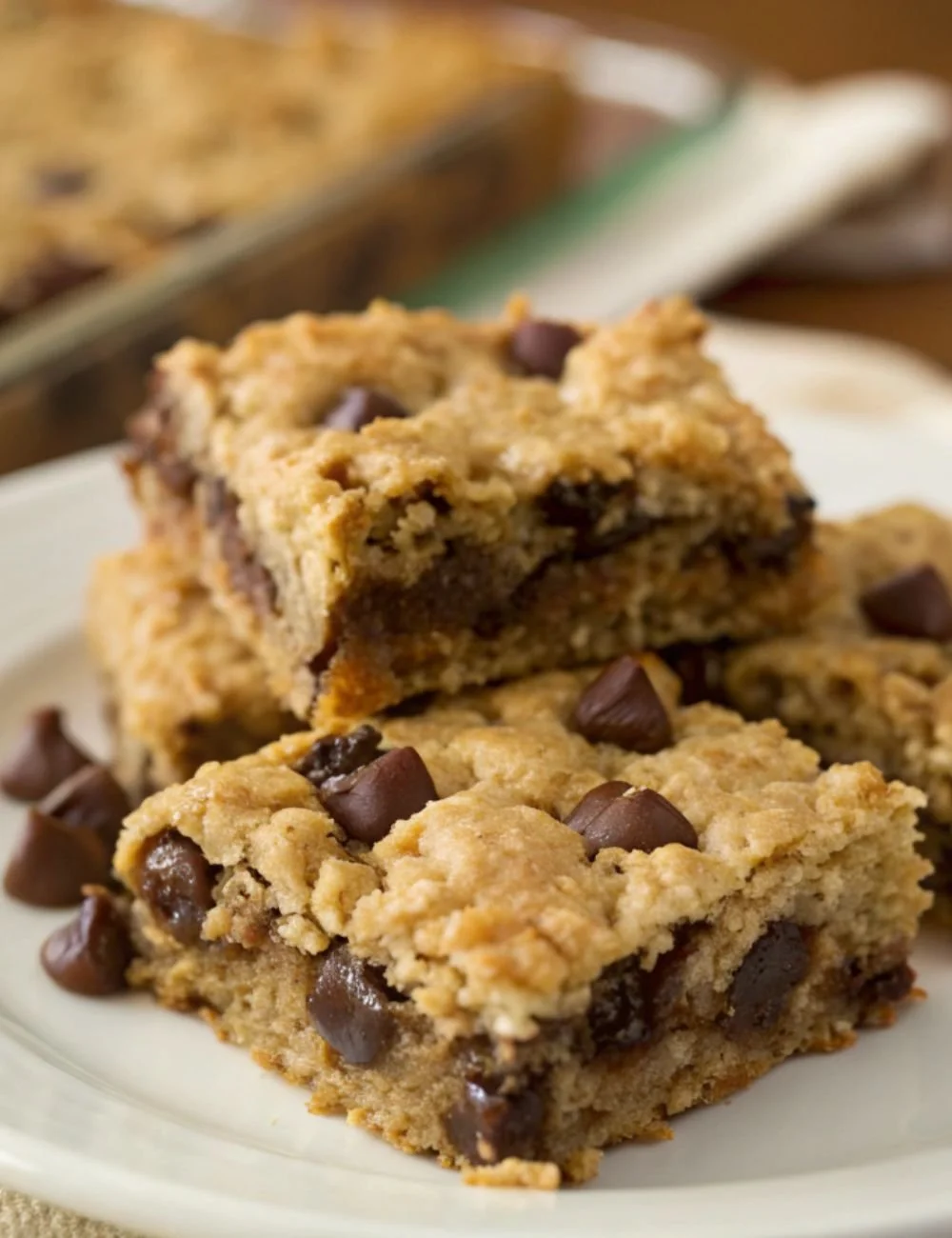 Homemade Chocolate Chip Oatmeal Bars on a wooden cutting board