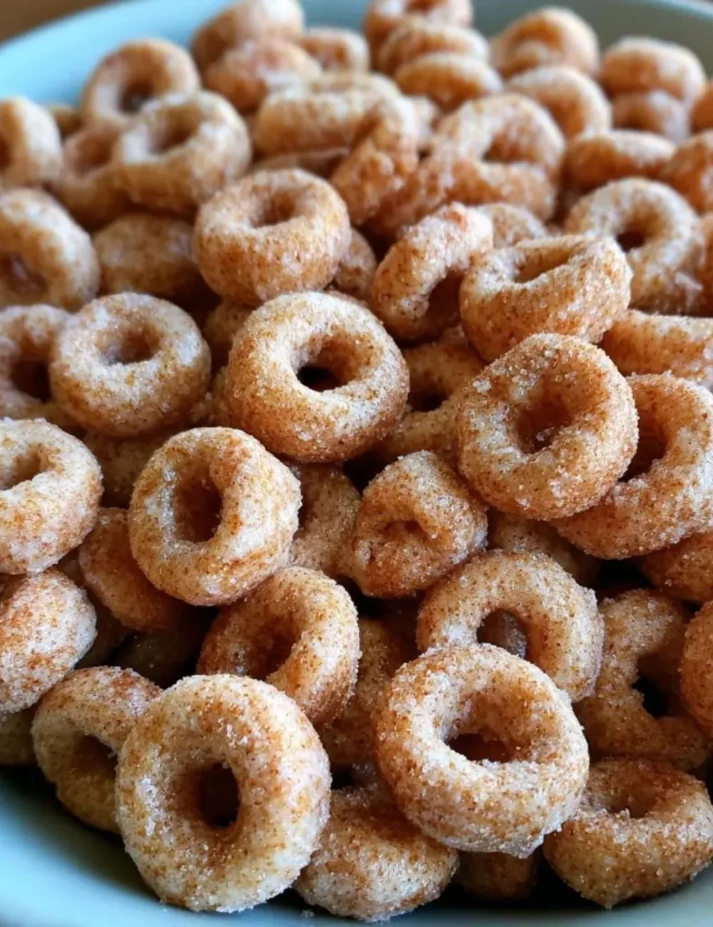 Mini Doughnut Hot Buttered Cheerios served in a bowl, showcasing a delightful dessert.