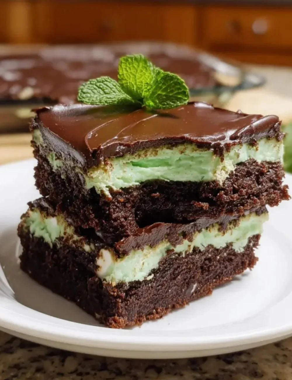 Delicious mint brownies topped with creamy mint frosting and chocolate drizzle