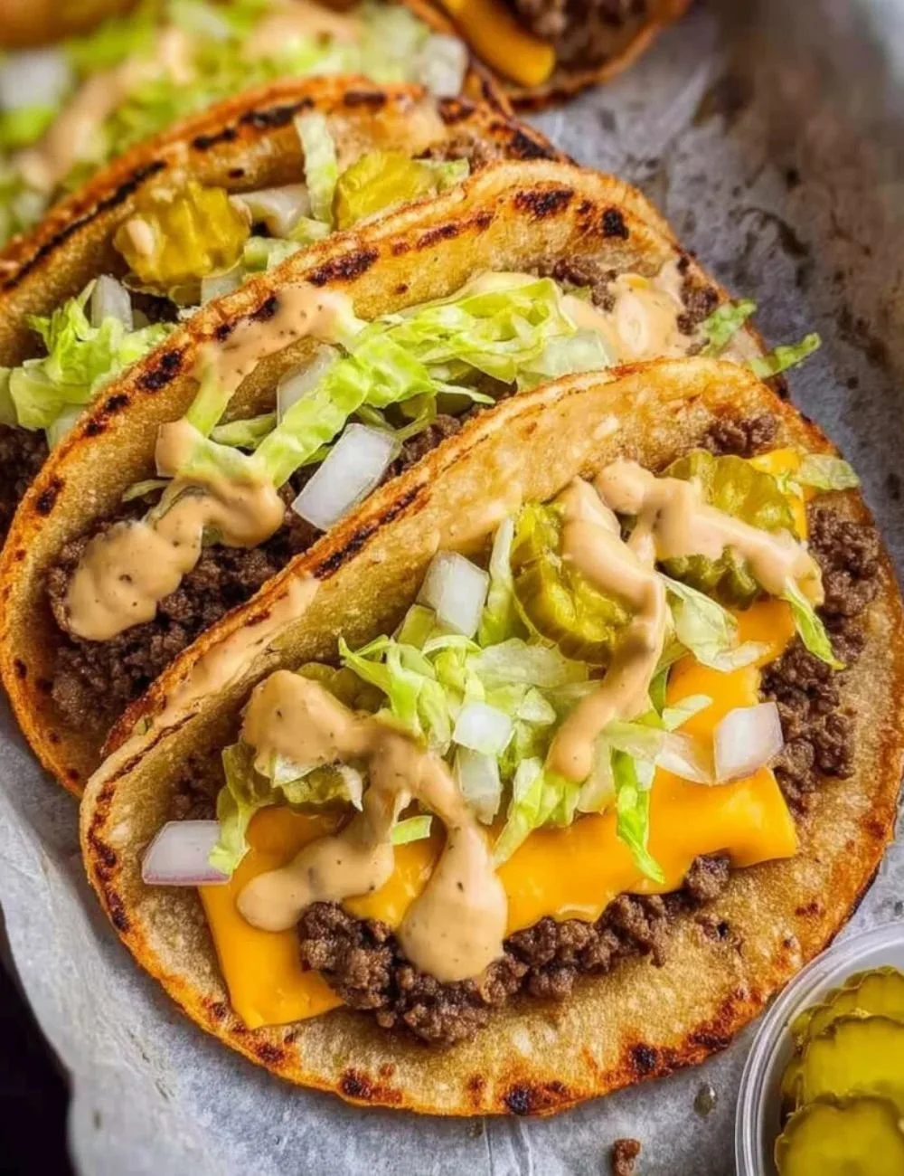 Delicious Smash Burger Tacos served on a plate with toppings