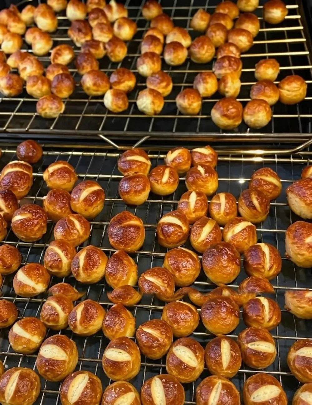 Soft and chewy sourdough discard pretzel bites on a wooden board
