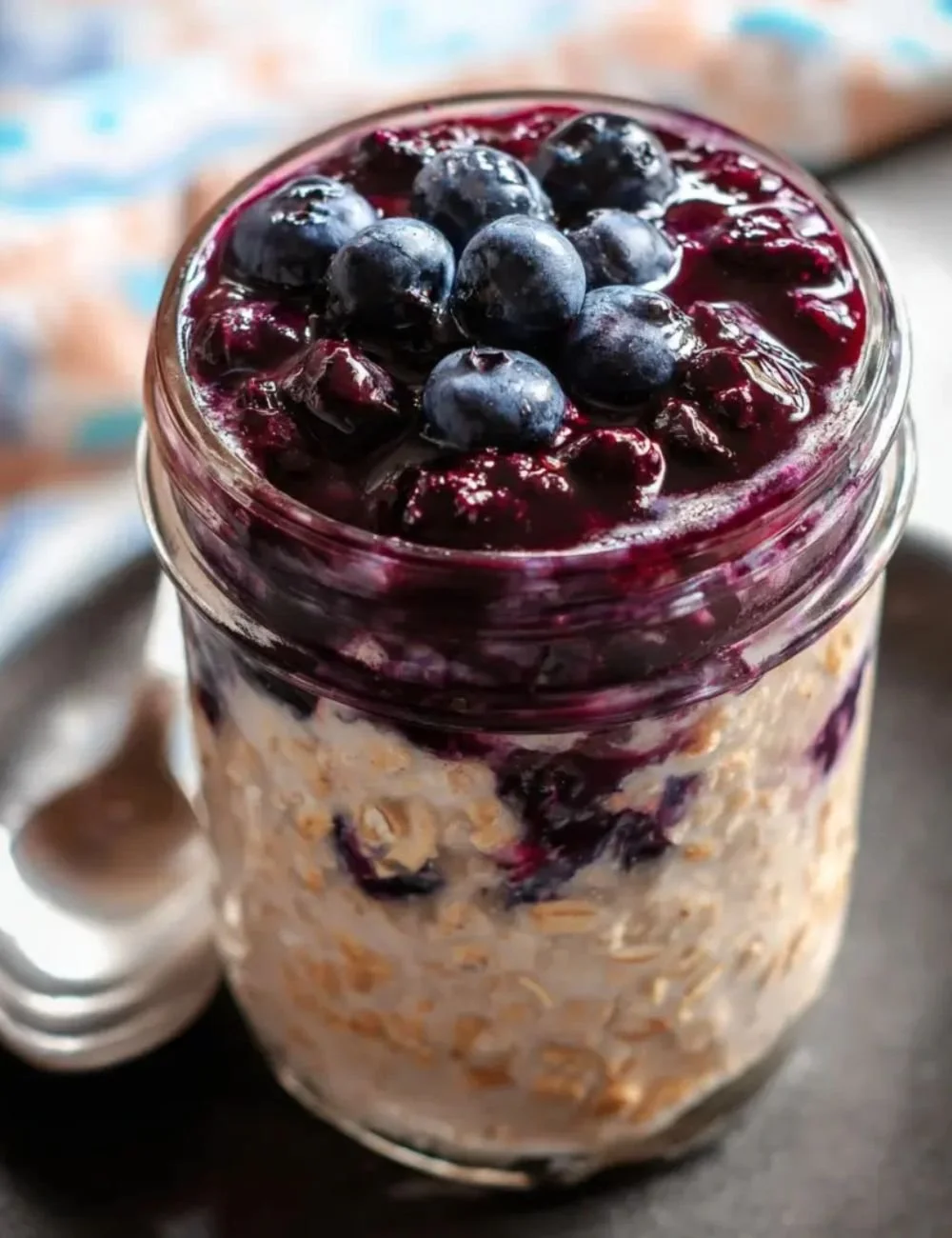 Delicious blueberry pie overnight oats topped with fresh blueberries and granola.
