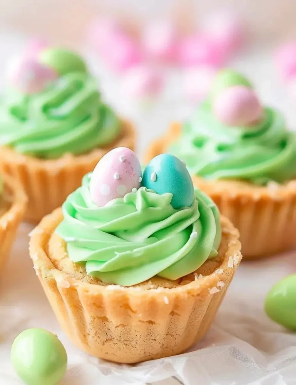 Easter Basket Sugar Cookie Cups decorated with colorful icing and candies