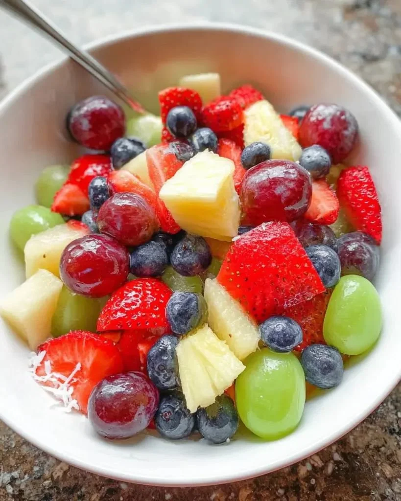 Delicious Pina Colada Fruit Salad with tropical fruits and coconut.